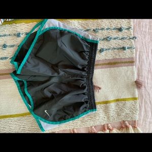 Grey and green Nike shorts